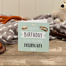  Birthday card for 'my favourite human' with a teddy bear and dog toys in the background.