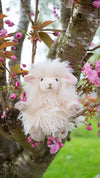 Beryl the sheep, a soft, white, adorable plush toy by Hannah dale. Beryl is a sociable and creative thrill-seeker. Wrendale Designs.