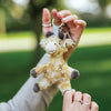 Accessorise your bag or keys with this adorable Camilla the giraffe plush keyring, designed by Hannah Dale. Soft, adorable and full of character, Camilla has a glamorous, entertaining and expressive personality. A perfect gift for animal lovers. Wrendale Designs.