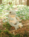 A cute, fluffy, junior frog plush named Elliott. Featuring a pale green body and pale yellow stomach. By Wrendale Designs.