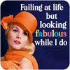 Funny woman's coaster; featuring a well dressed lady, looking into the distance, text behind her reads 'Failing at life but looking fabulous while I do'; by Dean Morris