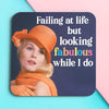 Funny woman's coaster; featuring a well dressed lady, looking into the distance, text behind her reads 'Failing at life but looking fabulous while I do'; by Dean Morris.