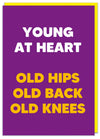 Tall, purple and bold. A hilarious birthday card perfect to bring a smile to your friends's face. Bright and big text reads 'Young at heart, old hips, old back, old knees'. A perfect funny birthday card. Dean Morris.