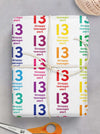 A cheeky and funky sheet of rainbow coloured wrapping paper for their 13th birthday. The wrapping paper features the number 13 in a repeating pattern all over the paper, acompanied by the text "Stroppy teenager alert." A perfect wrapping paper for those who like to laugh.
