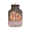 100% natural rubber hot water bottle, with cover. The brown cover features two adorable highland cow watercolour artworks printed onto the fabric, illustrated by Hannah Dale. Wrendale Designs.