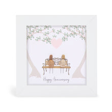  These small white shadow box frame gifts are made with a 4-inch white shadow box frame with a plexiglass insert, helping it be less fragile in the post and around the home. You can also easily take them apart to clean the inside of the glass or frame if you need to. They come individually boxed for added protection during shipping.

This white shadowbox framed pebble art features 2 people sittinng on a park bench. It reads Happy Anniverysary