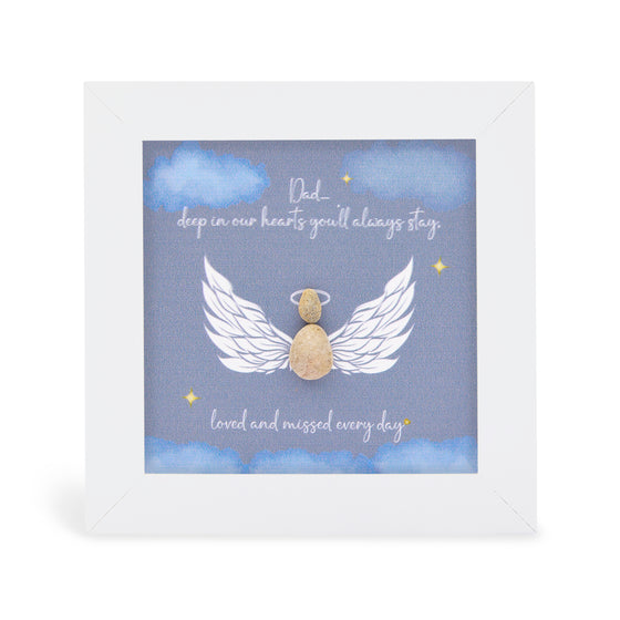 These small white shadow box frame gifts are made with a 4-inch white shadow box frame with a plexiglass insert, helping it be less fragile in the post and around the home. You can also easily take them apart to clean the inside of the glass or frame if you need to, They come individually boxed for added protection during shipping.
This white shadowbox framed pebble art print features an angel on a dark blue sky background. It reads Dad, deep in our hearts you'll always stay. Loved and missed
