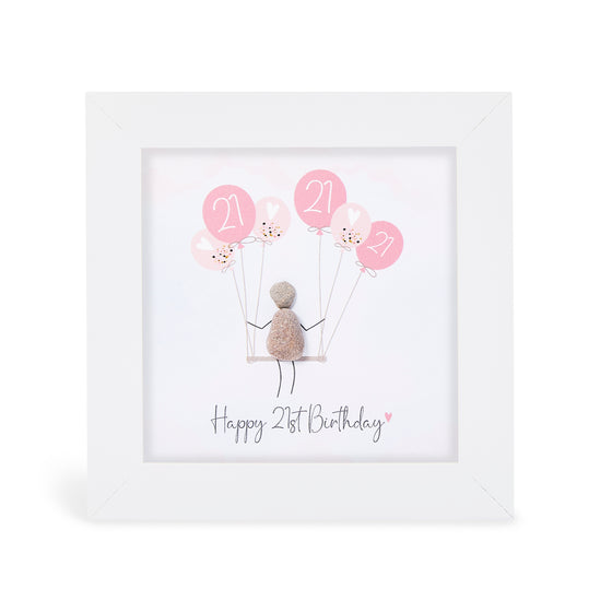 These small white shadow box frame gifts are made with a 4-inch white shadow box frame with a plexiglass insert, helping it be less fragile in the post and around the home. You can also easily take them apart to clean the inside of the glass or frame if you need to.&nbsp; They come individually boxed for added protection during shipping.&nbsp;

This white shadowbox framed pebble art print a girl sitting in a swing with shades of pink balloons overhead that all have 21 written in Happy 21st Birthday