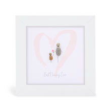 These small white shadow box frame gifts are made with a 4-inch white shadow box frame with a plexiglass insert, helping it be less fragile in the post and around the home. You can also easily take them apart to clean the inside of the glass or frame if you need to. They come individually boxed for added protection during shipping.

This white shadowbox framed pebble art print feature a child and adult walking through a soft pink heart. It reads Best Nanny Ever.