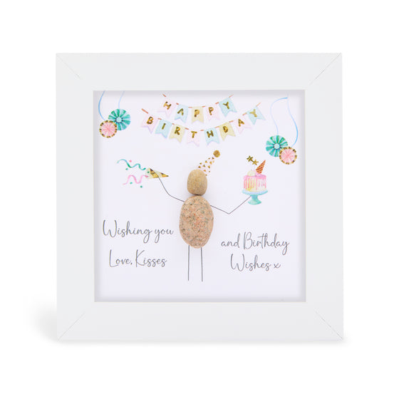 These small white shadow box frame gifts are made with a 4-inch white shadow box frame with a plexiglass insert, helping it be less fragile in the post and around the home. You can also easily take them apart to clean the inside of the glass or frame if you need to. They come individually boxed for added protection during shipping.

This white shadowbox framed pebble art features a birthday party scene a person wearing birthday hat holding a cake. It reads Wishing you Love, Kisses, a Birthday Wishes