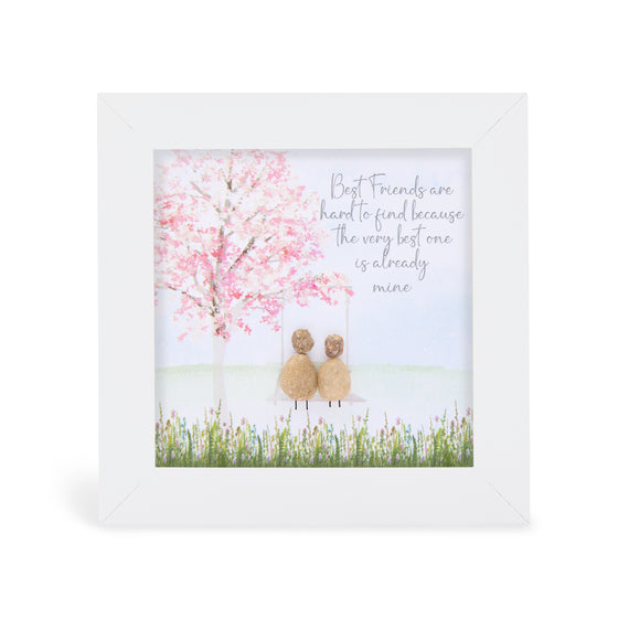 These small white shadow box frame gifts are made with a 4-inch white shadow box frame with a plexiglass insert, helping it be less fragile in the post and around the home. You can also easily take them apart to clean the inside of the glass or frame if you need to.&nbsp; They come individually boxed for added protection during shipping.&nbsp;

This white shadowbox framed pebble art print 2 people sitting under a tree. It reads Best friends are hard to find because the very best one is already mine.