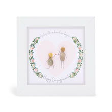  These small white shadow box frame gifts are made with a 4-inch white shadow box frame with a plexiglass insert, helping it be less fragile in the post and around the home. You can also easily take them apart to clean the inside of the glass or frame if you need to. They come individually boxed for added protection during shipping.

This white shadowbox framed pebble art features a couple inside a floral wreath design. It reads And so the adventure begins Happy Engagement
