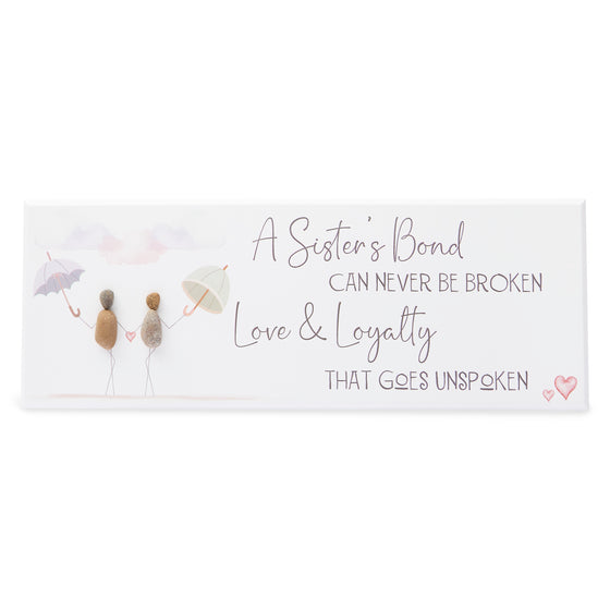 This beautiful wood plaque depicts 2 women walking with their umbrellas and it reads A sister’s bond can never be broken. Love &amp; loyalty that goes unspoken.
