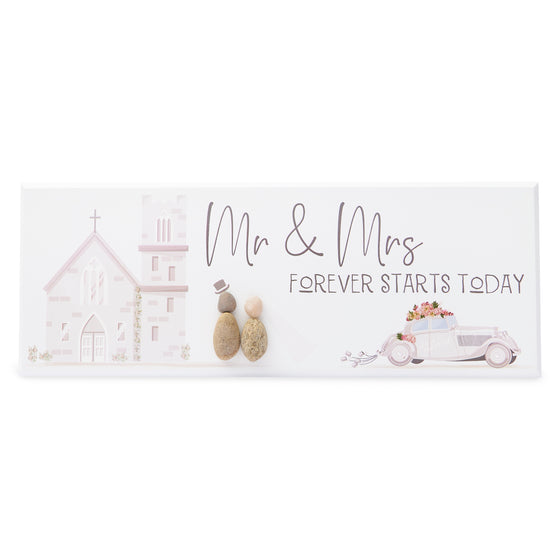 These wood plaques have all been painted white prior to their individual designs being painted on with the pebble art. They measure 32cm (L) x 12cm (W) x 1cm (D) and can be hung on the wall if desired.&nbsp;

This beautiful wood plaque depicts a beautiful church in the background and a bride &amp; groom. It reads Mr &amp; Mrs Forever Starts Today.
