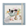 A beautiful, rustic, farmland password book. Centering a beautiful illustration by Wrendale Designs. A farm dog sleeping in a wheelbarrow of crops. 2 Sneaky rabbits, nibbling on some carrots from the wheelbarrow. A perfect gift.