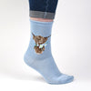 Daisy Coo, a warm pair of high quality, pale blue, white striped bamboo socks. Featuring gorgeous artwork by Hannah Dale, a cute highland cow holding daisys in it's mouth, stitched into the soft fabric. A perfect gift for animal lovers. Wrendale Designs.