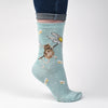 Oops a Daisy, A warm pair of high quality, light blue, white polkadot bamboo socks for women. Designed by Hannah Dale, these socks feature a beautiful illustration of a country mouse holding onto a daisy stitched into the soft fabric. A perfect gift for animal lovers. Sock size 4 to 7. Wrendale Designs.